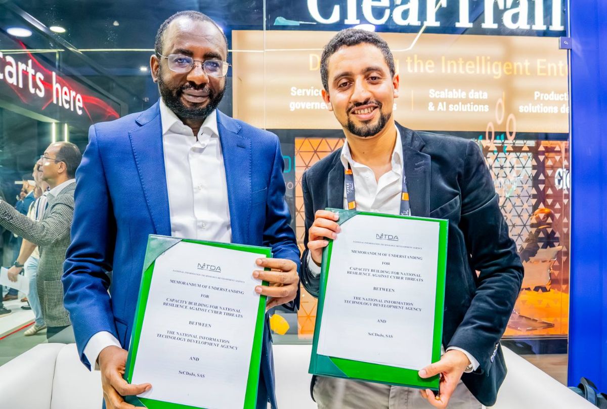 NITDA and SecDojo representatives holding signed agreements at an event